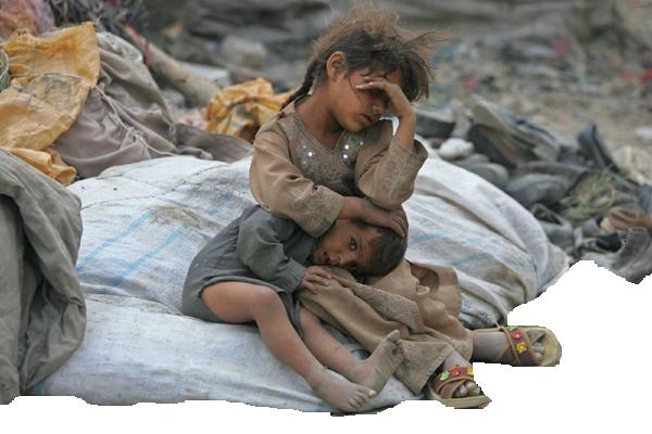 afghan girl holds her brother as they take a break from searching for items to recycle in kabul